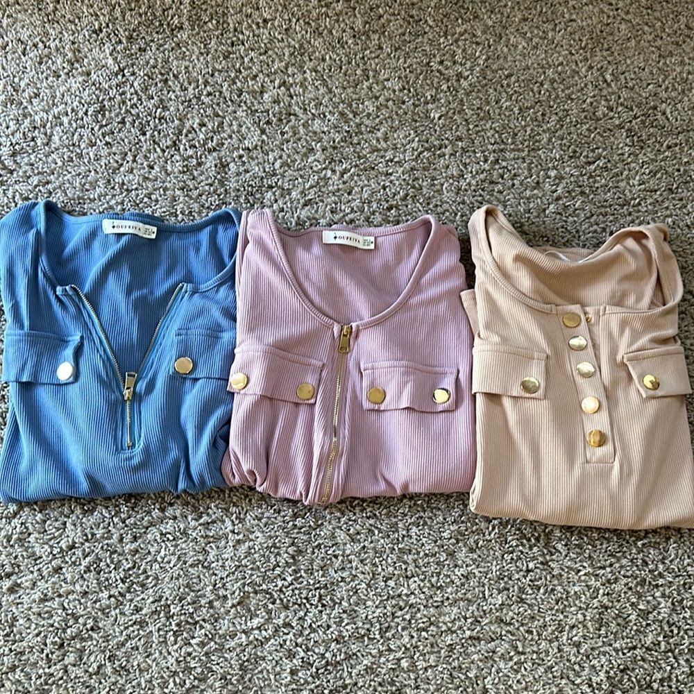 NWOT Oufeiya 1 light pink, 1 blue and 1 cream colored tops. Size M